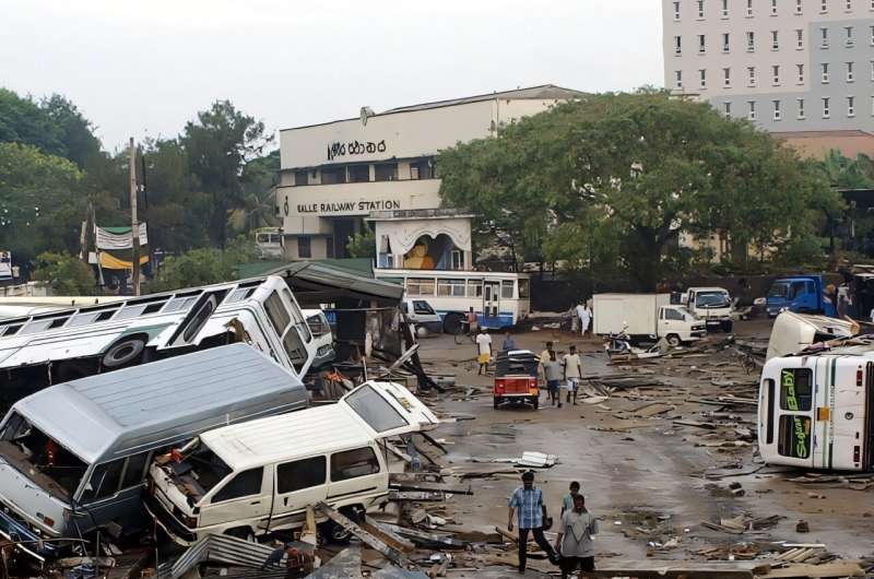 A combination photo shows vehicles damaged in the December 26, 2004 tsunami around the main bus terminal in Sri Lanka's Galle city on December 27, 2004 and buses at the same terminal on December 1, 2024.