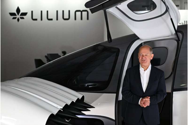 German Chancellor Olaf Scholz with a Lilium jet at an aerospace exhibition